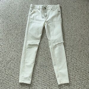 Free People cream colored pants ripped knees size 28 never worn